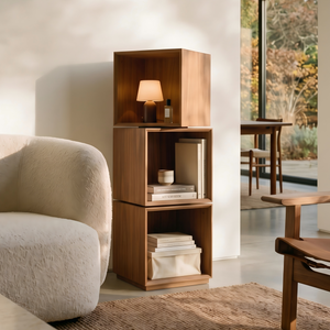 Eureka Ergonomic Cubo walnut rotating storage cabinet in a bright living room beside a cream boucle sofa with a lamp on top