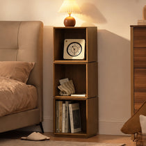 Eureka Ergonomic Cubo three-tier walnut rotating storage cabinet used as a bedroom nightstand with lamp, clock and books