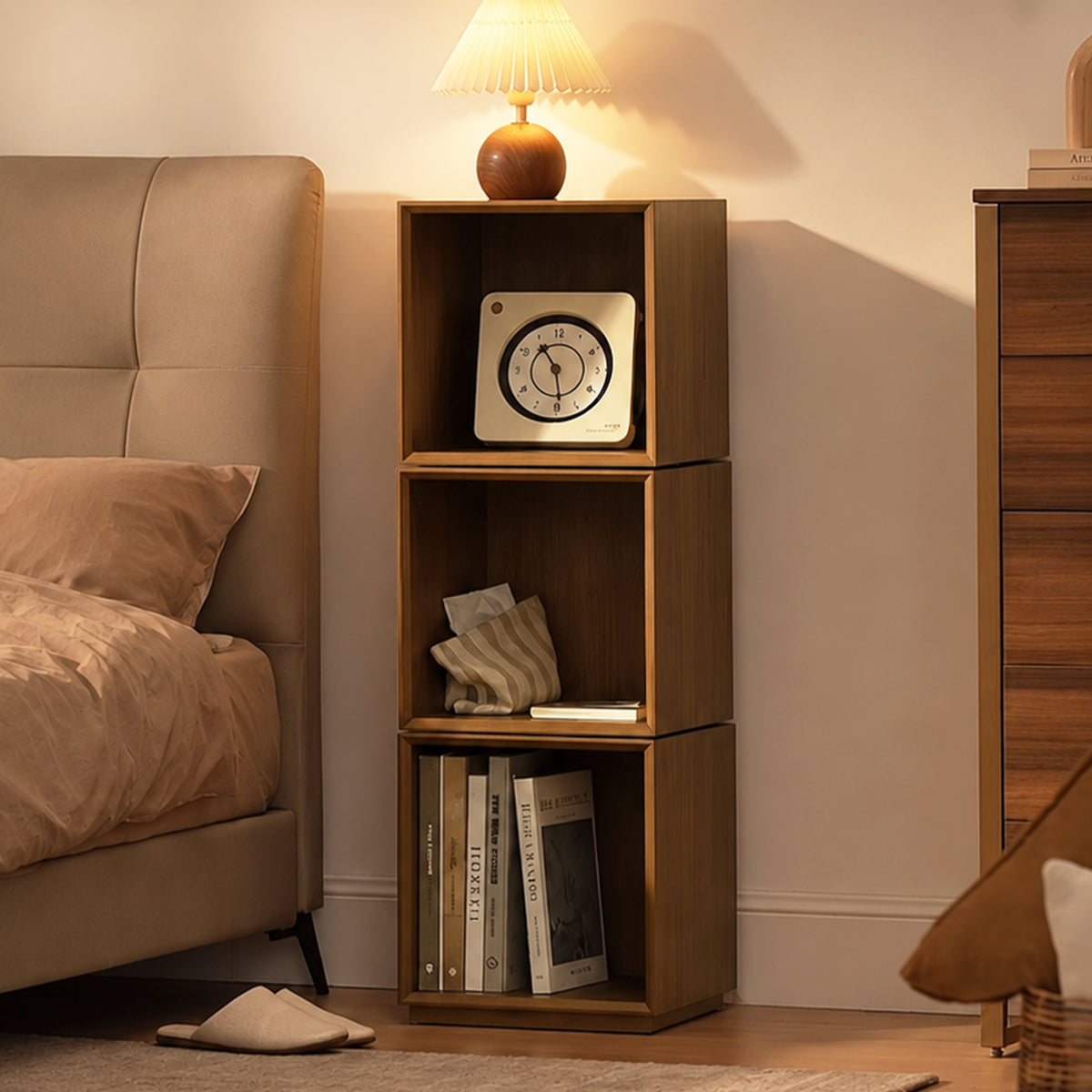 Eureka Ergonomic Cubo three-tier walnut rotating storage cabinet used as a bedroom nightstand with lamp, clock and books