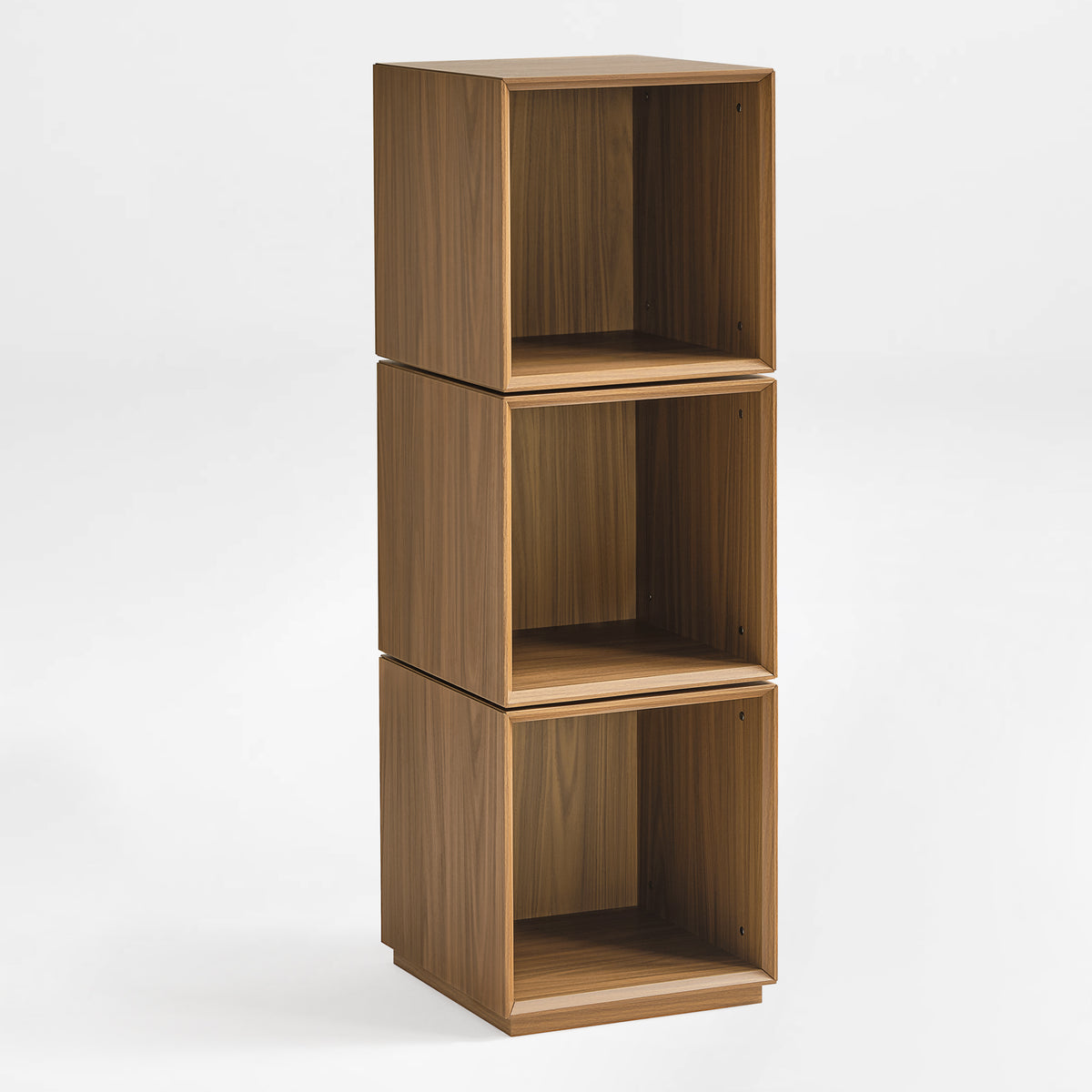Eureka Ergonomic Cubo three-tier walnut rotating storage cabinet, empty open cubes from front three-quarter angle on white