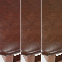 Close-Up of Brown Leather Dining Chair Seat, Showcasing Leather Texture and Mid-Century Modern Design.