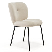 Off-White Upholstered Dining Chair With Black Metal Legs, Ideal for Modern Dining Areas.