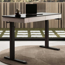 47 Standing Desk With Drawer, Black Top and Wood Finish in a Modern Home Office Setting.