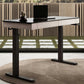 47 Standing Desk With Drawer, Black Top and Wood Finish in a Modern Home Office Setting.