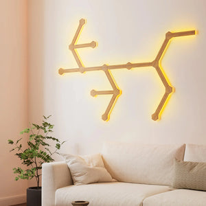 Soho Art Lighting: Modern Wooden Wall Light Fixture With Warm Yellow Glow Above Beige Sofa in a Living Room Setting.