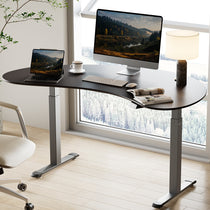 Eureka Ergonomic Cashew Shape Standing Desk in Home Office Setting With Laptop and Monitor.