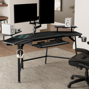 Black Eureka Ergonomic Aero Wing-Shaped Studio Desk With Accessories and Dual Monitors Setup.