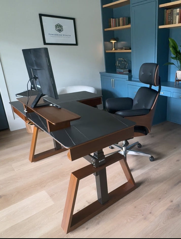 Standing desk and ergonomic office chair installed in a home workspace