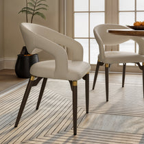 Chantilly Leather Dining Chairs Set of Two in Cream Faux Leather With Dark Brown Legs and Gold Accents.