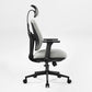 Flex Ergonomic Office Chair in Gray Fabric With Adjustable Headrest and Black Frame, Supporting Ergonomic Posture.