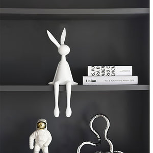 White Rabbit Ornament HD-06, With Other Decorative Items On a Gray Shelf, Minimalist Home Decor.