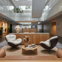 Alexia Swivel Lounge Chair in Cream and Dark Brown, Ergonomic Design, Perfect for Modern Office.