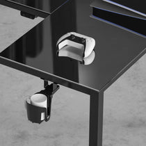 Eureka Ergonomic GTG-L60 L-Shaped Gaming Desk With Cup Holder and Controller On a Black Glass Surface.