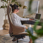 Woman sitting at a desk with a laptop in a home Serene Ella  Executive office  chair