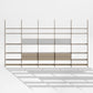 Eureka Ergonomic Arundel floor-to-ceiling shelving system, studio front view with open shelves on white