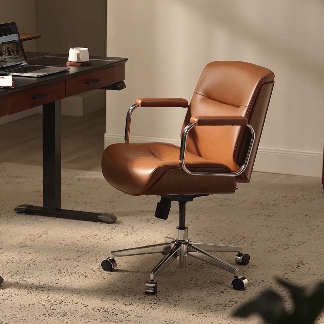 Eureka Ergonomic brown Mathias Mason low back office chair in a modern office, shown in a video preview